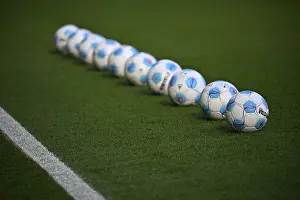 Category Historic EN Prints: Adidas Derbystar match balls are lined up on the pitch