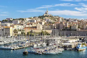 Aerial panoramic view on basilica of Notre Dame de la Garde and old port in Marseille
