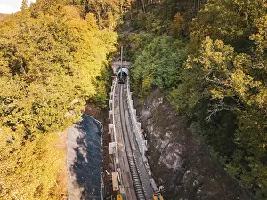 Aerial view of an autumn rail construction site in the forest