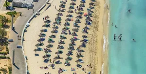 Aerial view, beach life with straw parasols at Playa de Palma