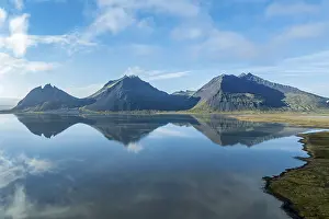 Aerial view over the calm sea to Mt