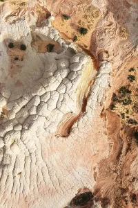Aerial view capturing a desert landscape with rock formations