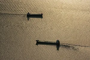 Aerial view of cargo ships on the Elbe at sunset