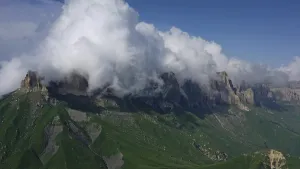 Aerial view on Caucasus mountains under epic clouds