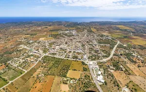 Aerial view, city ring and town view with church Sant Andreu in Santanyi