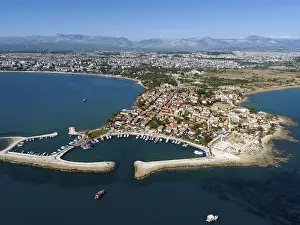Aerial view of a coastal town with boat harbour