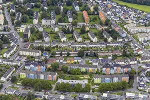 Aerial view, colourful house facades of the GWG housing estate on the street Am Quambusch in the Haspe-West district of