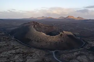 Aerial view of the El Cuervo volcano at sunrise