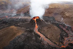 Aerial view, erupting volcano, crater with erupting lava and lava flow