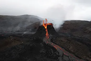 Aerial view, erupting volcano, crater with erupting lava and lava flow