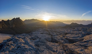 Aerial view over the glacier foreland of the Zanfleuron glacier with rising sun