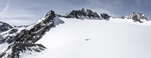 Aerial view of a group of alpinists in the high mountains with the glacier Lisener Ferner