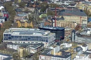 Aerial view, Husemann Karree, red brick building inner courtyard with construction site for Haus des Wissens