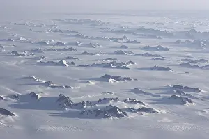 Aerial view, inland ice, ice sheet with glaciated mountain ranges