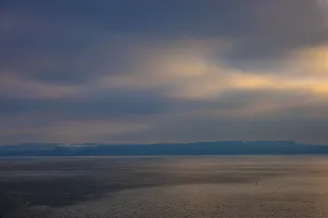 Aerial View over Lake Neuchatel in a Cloudy Day with Sunlight in Neuchatel