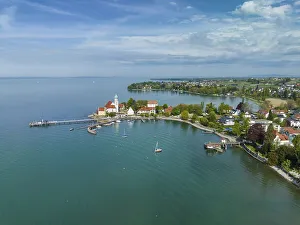 Aerial view of the moated castle peninsula on Lake Constance with the baroque church of St
