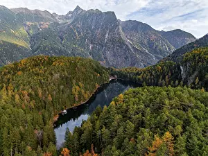 Aerial view, mountain peaks of the Oetztal Alps reflected in Lake Piburger See