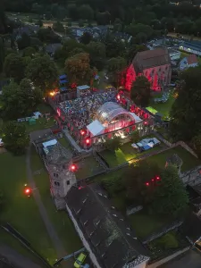 Aerial view at night of a town with illuminated concert
