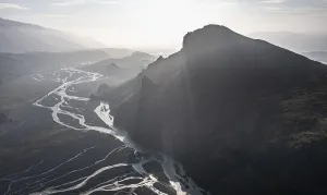 Aerial view, panorama, mountains and glacier river in a mountain valley