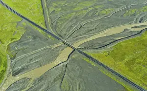 Aerial view of Ring Road No. 1 with a bridge crossing a tributary of the Skaftafellsa glacial river