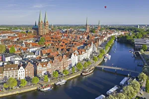 Aerial view over the river Trave and old sailing ships and boats in the old town of the Hanseatic City of Luebeck