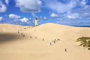 Aerial view of Rubjerg Knude lighthouse in a large sand dune