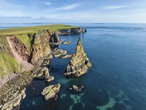 Aerial view of the rugged coastal landscape with the Duncansby Stacks