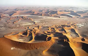 Aerial view of salt pans and red sand dunes of the Namib Desert
