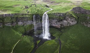 Aerial view, Seljalandsfoss waterfall falls from high cliff