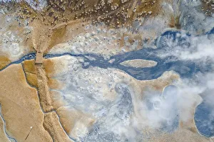Aerial view, small bridge over steaming river and fumaroles