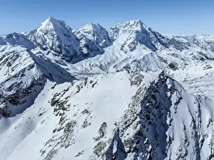 Aerial view, snow-covered mountain landscape