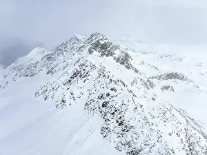 Aerial view, Snowy mountain landscape in fog