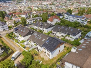 Aerial view of a suburb with many houses that have solar modules