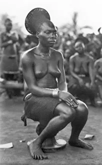 African woman sitting, historical photo