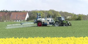Agriculture, pesticide being sprayed on a field in spring