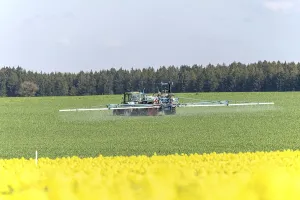 Agriculture, pesticide being sprayed on a field in spring