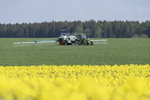 Agriculture, pesticide being sprayed on a field in spring