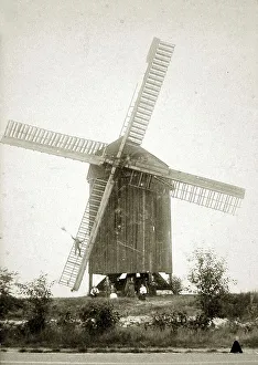 Agriculture, windmill, man greets from the windmill wing