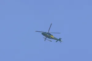 Agusta AW119 Koala Mk.II helicopter flying in a blue sky