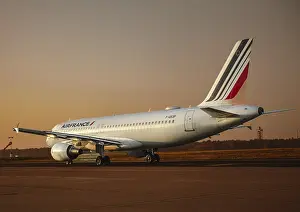 An Air France aircraft on the runway at sunset