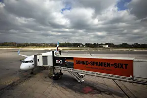 Aircraft Airbus A320 of the airline Eurowings GmbH at passenger boarding bridge or finger