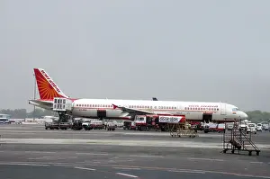 Category Historic EN Prints: Aircraft loading and uploading luggage at indira gandhi international airport