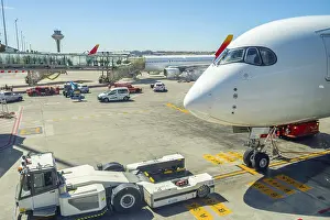 Airplane parked at an airport gate