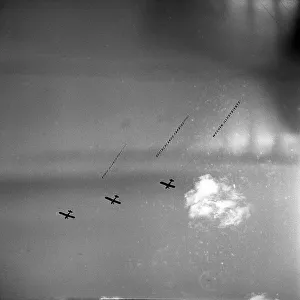 Three airplanes with banner fly synchronously