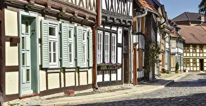 Alley with half-timbered houses and cobblestones