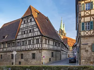 Alley with half-timbered houses and cobblestones