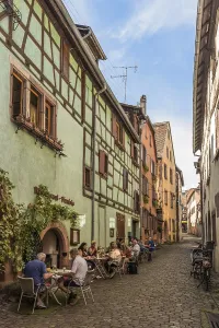 Alley with historic houses in the old town centre of Riquewihr