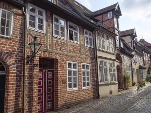 Alley with traditional half-timbered houses and lanterns