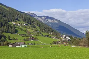 Alm with hay barn and mountains