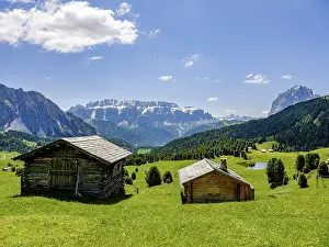 Alpine huts, Sella Group and Sassolungo in the background